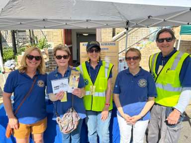 North Shore Kiwanis Club President Roger Hill (Far R.) says the Sea Cliff Mini Mart is a hallmark event in the community.