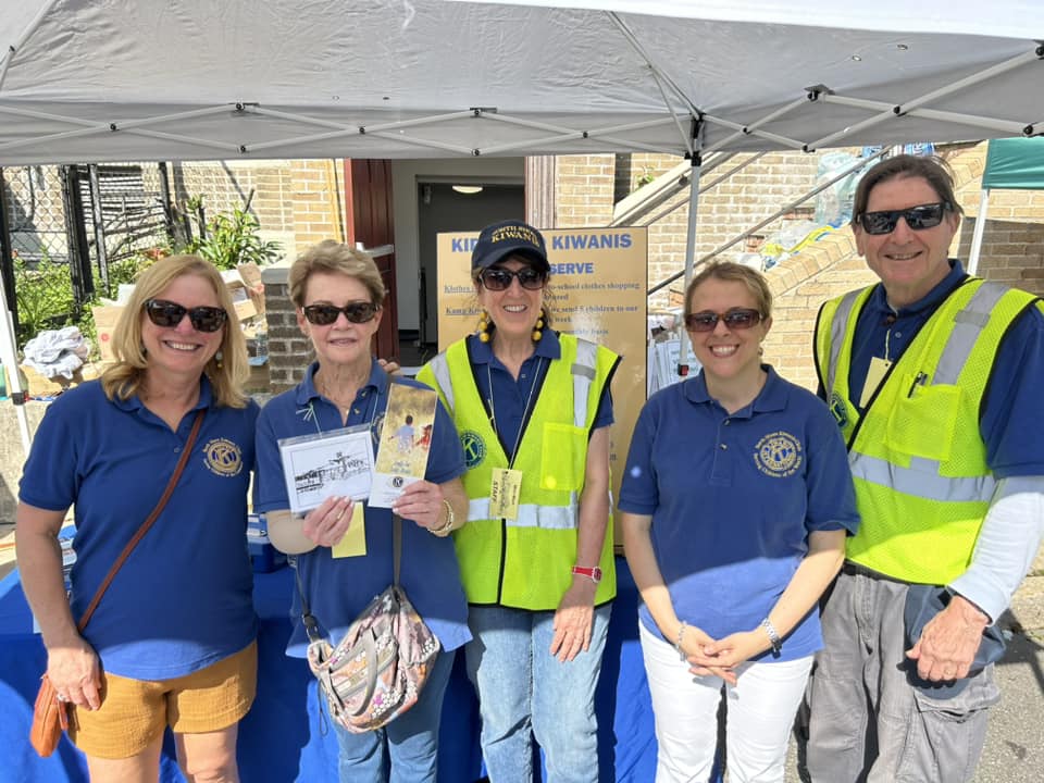 North Shore Kiwanis Club President Roger Hill (Far R.) says the Sea Cliff Mini Mart is a hallmark event in the community.