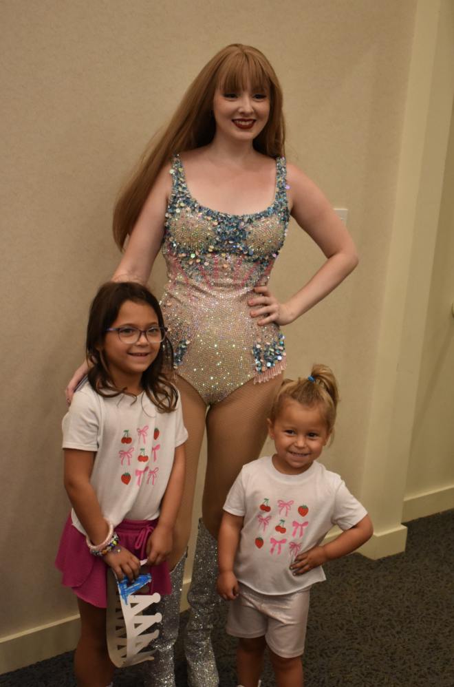 Singer Elizabeth Edquist poses with attendees after her Taylor Swift tribute concert.