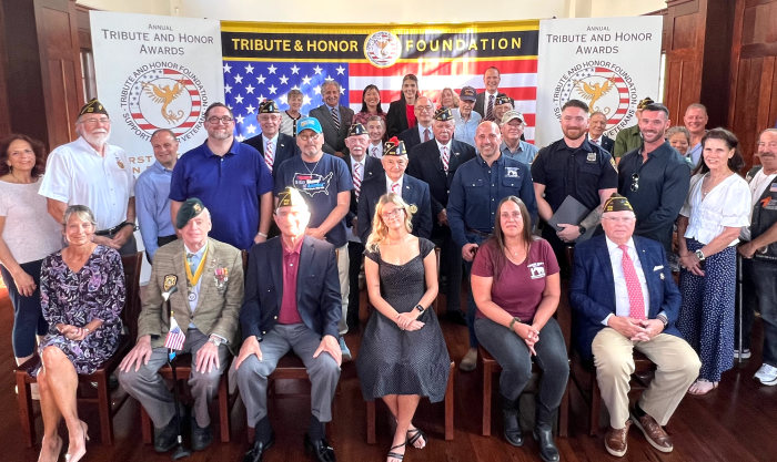 Tribute & Honor Foundation honorees, alongside family members, board members, veterans, and elected officials at the North Shore Historical Museum.