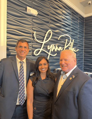 Syosset-Woodbury Chamber of Commerce President Russel Green, Dr. Lynna Pillai, and Nassau County Legislature Deputy Minority Leader Arnold Drucker (L. to R.) at the practice's ribbon-cutting ceremony.
