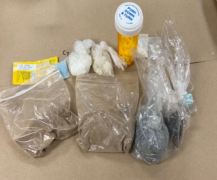 Four searches resulted in multiple drugs, weapons being seized.