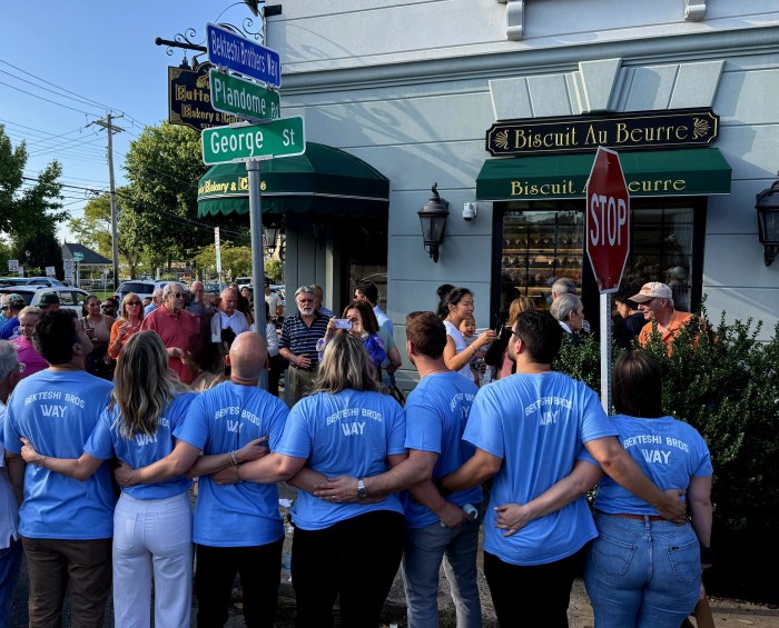 Donald and Eli Bekteshi's children at the ceremony. Photo provided by Nancy Bekteshi