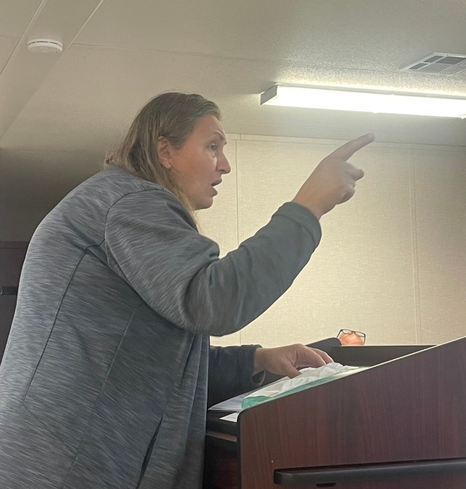 Great Neck homeowner Olimpiada Munteanu clashed with the Village of Great Neck at a board meeting.