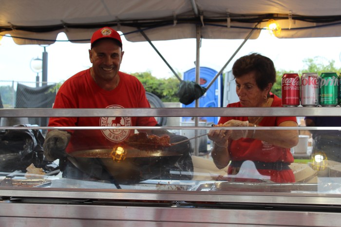 Volunteers helped serve and cook pasta in the pasta and meatballs tent.