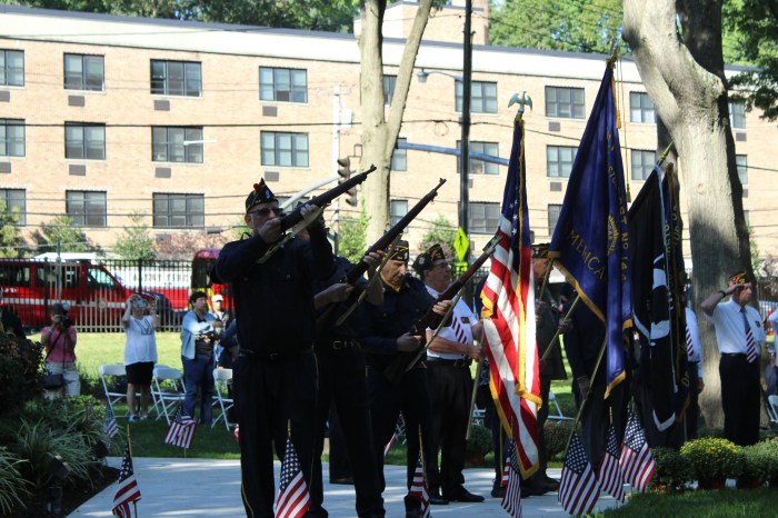 American Legion Post 144 firing their rifles.