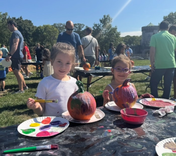 Children painting pumpkins.
