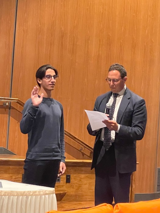 Maxwell Pour was sworn in as an ex-officio student member of the school board.