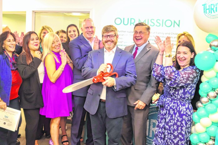 FCA’s Ryan Kiser (holding scissors), FCA President and CEO Dr. Jeffrey Reynolds (left), Suffolk County Executive Edward P. Romaine (right) and FCA staff and supporters celebrate opening another THRIVE center to help those in addiction recovery.