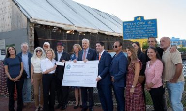The Roslyn Grist Mill received first half of $2 million fund for restoration from Nassau County Executive Bruce Blakeman.