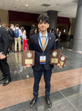 Dev Lakhani as a sophomore with his three state awards at New York State Future Business Leaders of America competition.