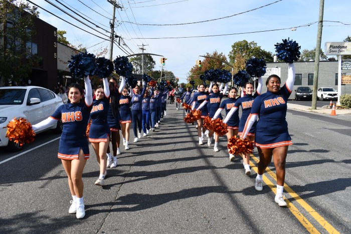 The cheer team participated in the homecoming parade.