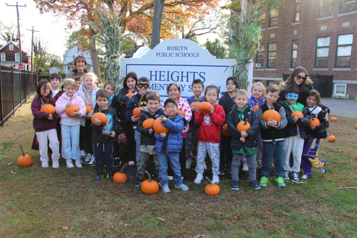 Heights School celebrating pumpkin picking day.