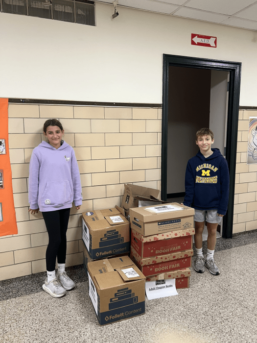Rushmore Avenue students with the boxes of books collected.