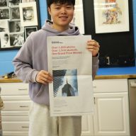 Tony Pan, a Jericho high schooler, poses with his photo in the New York Times.