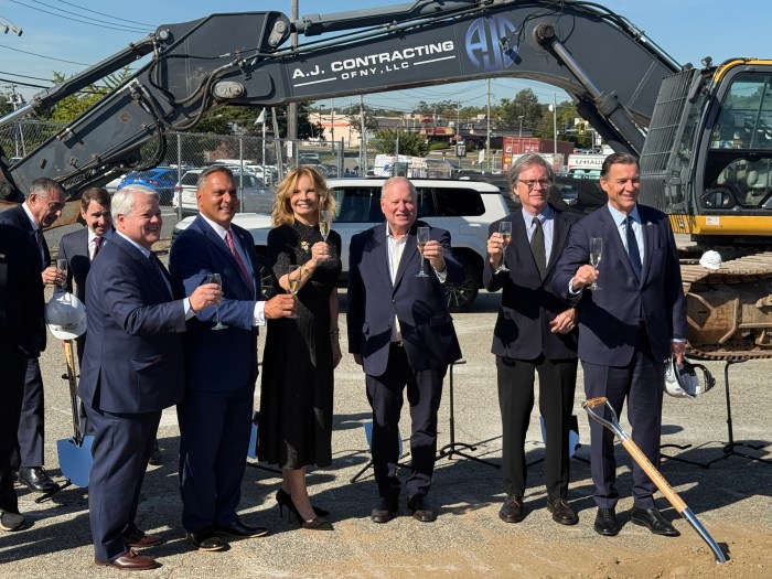 The groundbreaking was celebrated with a champagne toast.