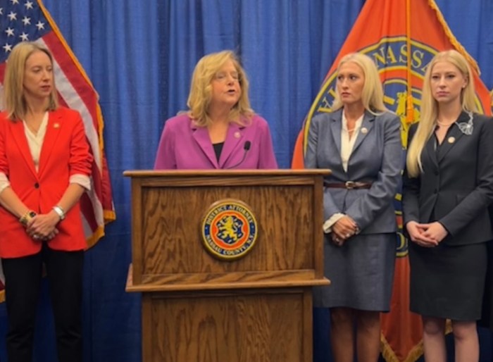 State Inspector General Lucy Land (L.) and Nassau County District Attorney Anne Donnelly (C.) made the indictment announcement together.