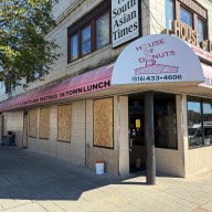 A fire in Hicksville burned through businesses and injured one firefighter.