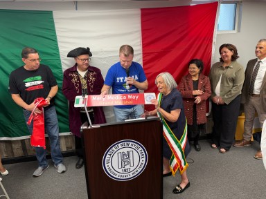 Mary Modica, the grand marshal for the festival (R.) was given a dedicated street sign and multiple proclamations.