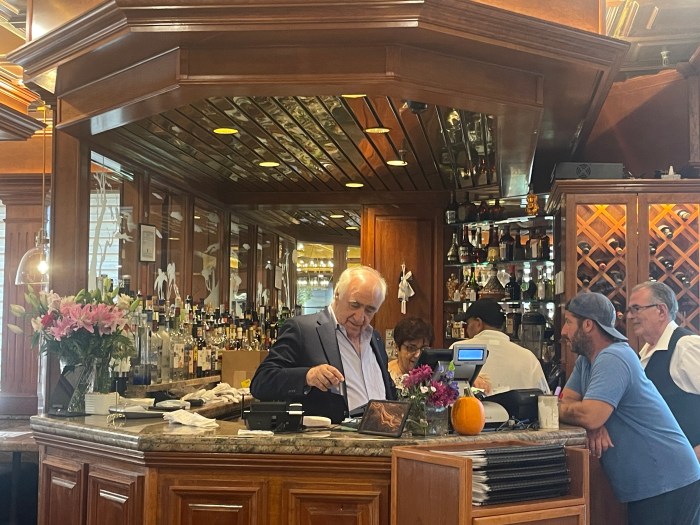 Greenvale Townhouse Diner, Savas Fereos, helping a customer.