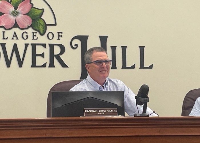 Flower Hill Mayor, Randall Rosenbaum, addressed a resident's concerns over a new tree law that requires homeowners that remove a tree to replace it or pay a fee.