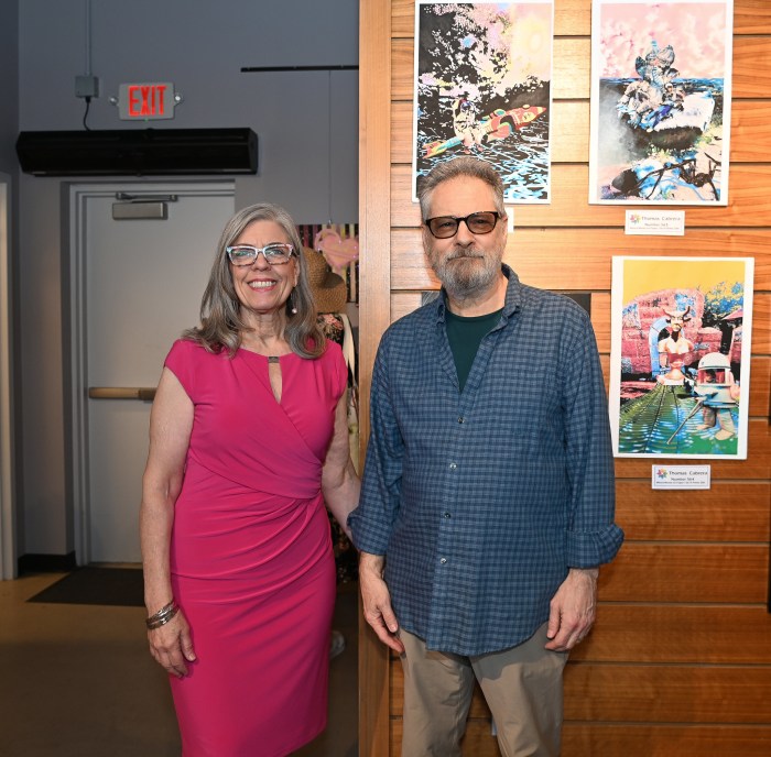 Westbury Arts President Julie Lyon with her husband Thomas Cabrera with his artworkNumber 564 - Mixed media on Paper.