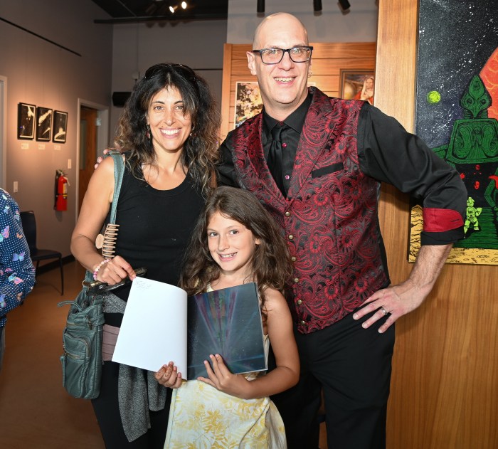 Martine Bavaro with her daughter Martina Bavaro with a signed book by Jay Stuart.
