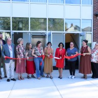 Glen Cove Board of Education Vice President Anne Markoulis, President Angela Riamo and Superintendent Alexa Doescher (C.) cut the ribbon on the new extension at Landing School.