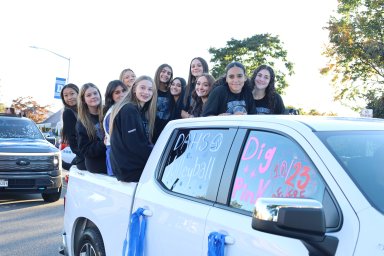 Members of the Division Avenue High School volleyball team joined the annual homecoming parade.
