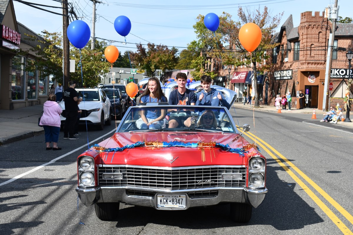 High school juniors cruised through the homecoming parade in a classic caddy.