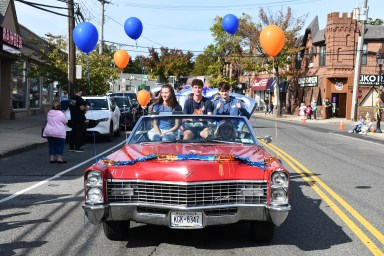 High school juniors cruised through the homecoming parade in a classic caddy.