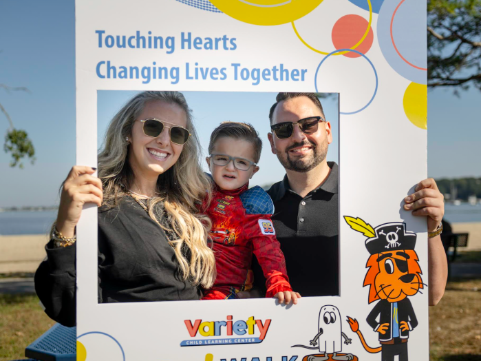 Variety Child Learning Center's Boo! Walk honoree, Luca P. (C.) with his parents.