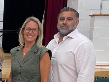 Locust Valley Board of Education Trustee Lauren Themis (L.) and President George Vasiliou (R.)