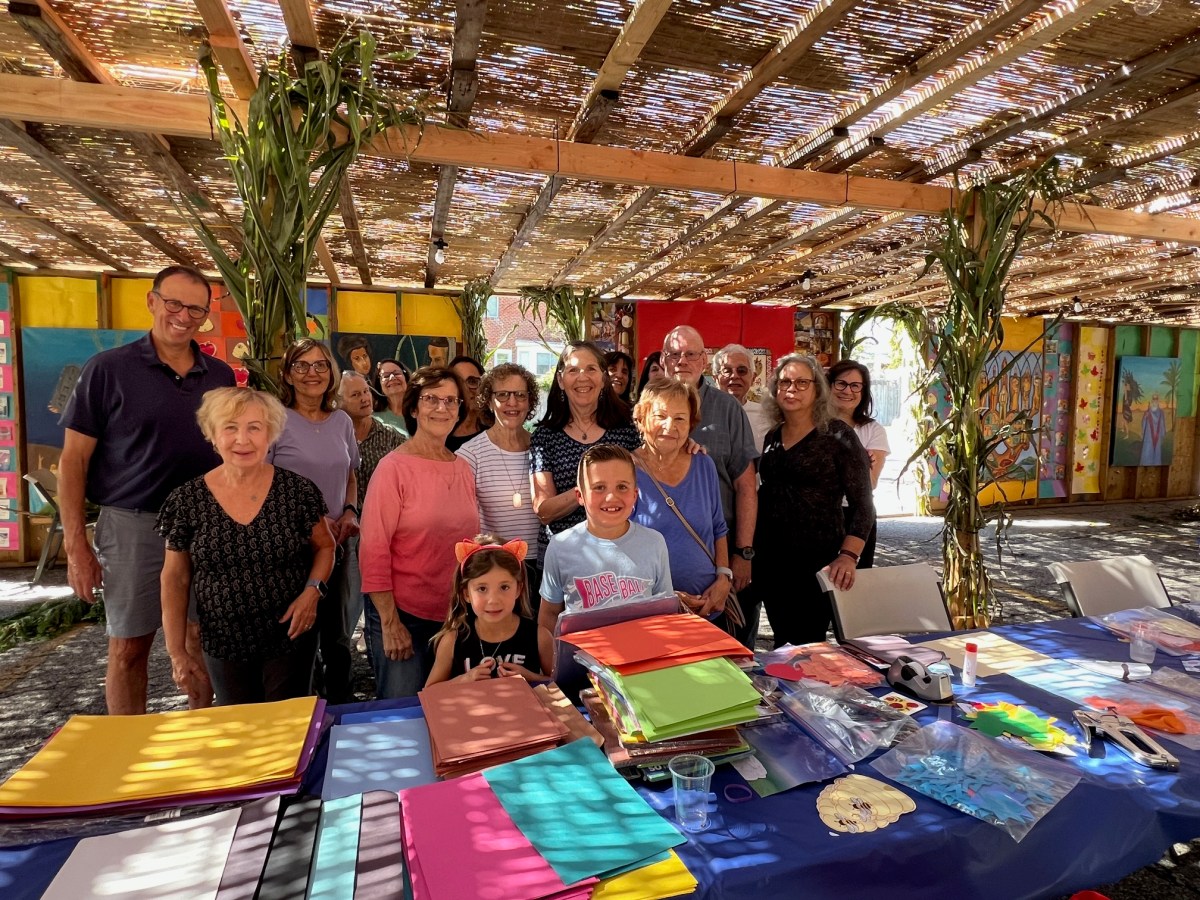 Shelter Rock Jewish Center at work decorating its Succah in advance of the festival of Succoth with a meal for up to 200 persons.