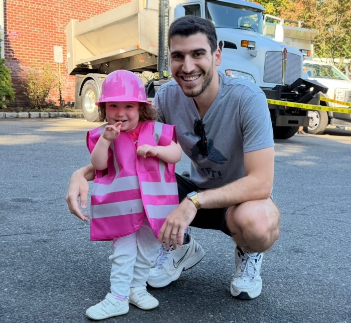 Isaac Anteby brought his 2-year-old daughter, Audrey Anteby, to the Touch-a-Truck event.