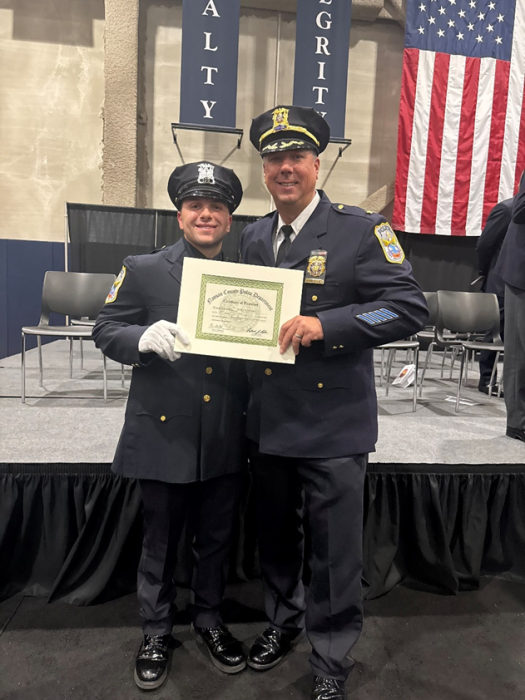 Recent academy graduate, Officer Sam Contino, stands proudly with PWPD’s Deputy Chief William Zwerlein at his graduation.