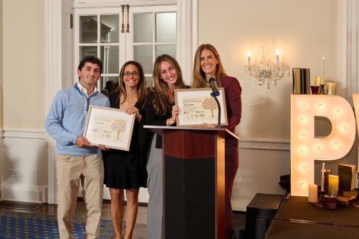 From (L.) to (R.) Roots Leadership Student in Bloom award winner Lucas Gordon, Port Washington Library Foundation Board Member Michelle Salzman, Leadership Student in Bloom award winner Alanna LaMorte, and Port Washington Library Foundation president Beth Ain.