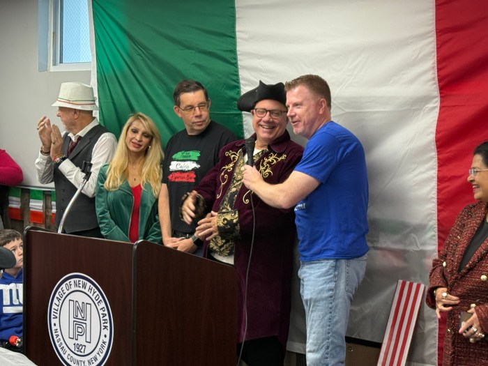 The New Hyde Park Village Hall was decorated in green, white and red for its Columbus Day celebration.