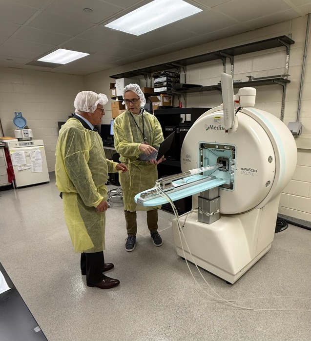 Lyons and Lavine look at the new advanced preclinical X-ray radiotherapy system.