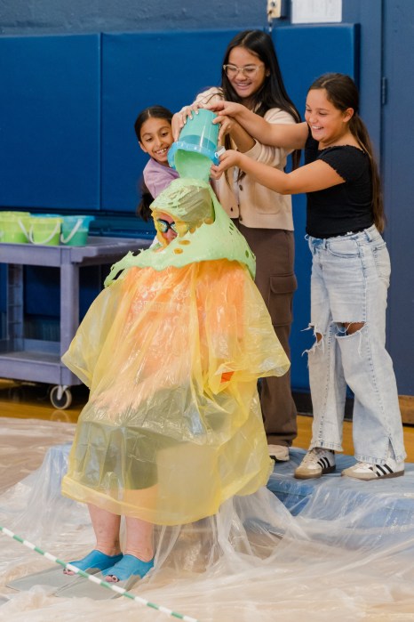 Following the duct tape spectacle, the entire student body gathered in thegymnasium for the grand finale: sliming principal Kerri McCarthy.