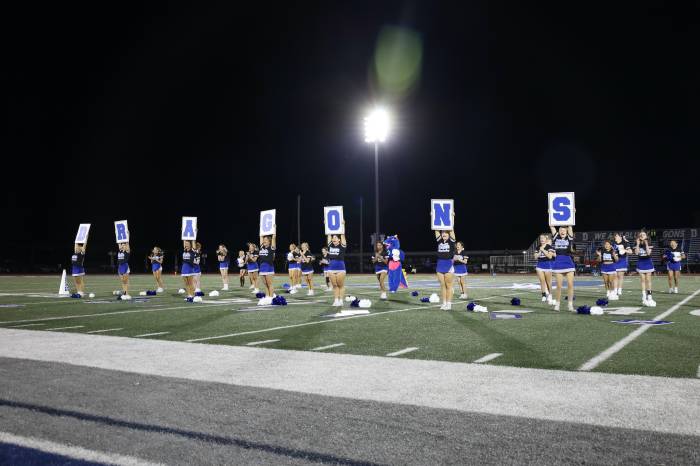 During halftime, cheerleaders put on a performance.
