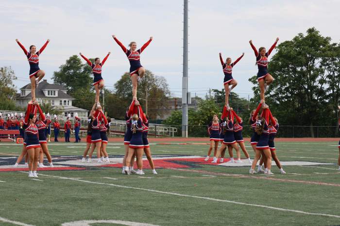 The cheer team wowed the crowd with their high-flying routines.