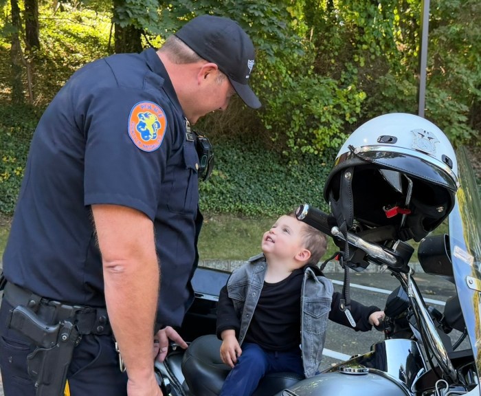 Children sat on top of motorcycles and interacted with police officers at the Touch-a-Truck event.