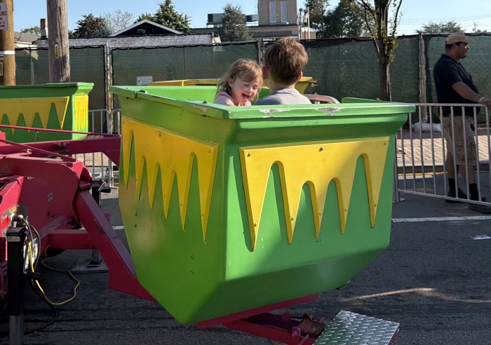 Children enjoyed various attractions, including spinning rides, bounce houses and parachute games at the street fair.