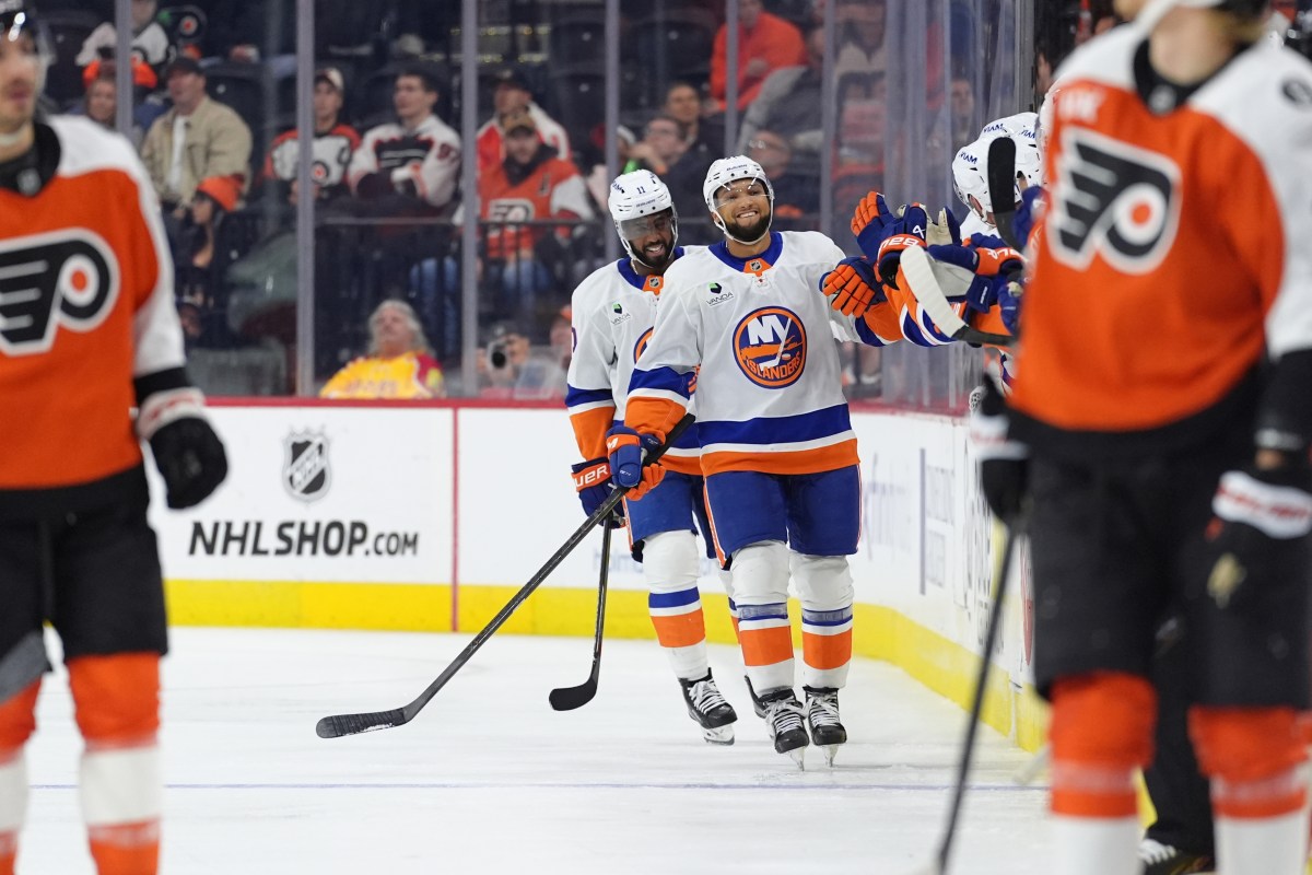 New York Islanders defenseman Marshall Warren (41) celebrates recording his first NHL point in his first career game.