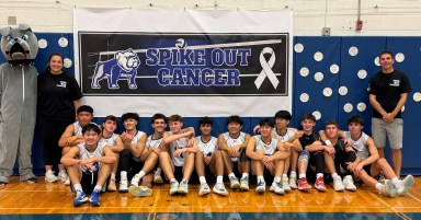 Roslyn Varsity Boys Volleyball team at Spike Out Cancer Event.