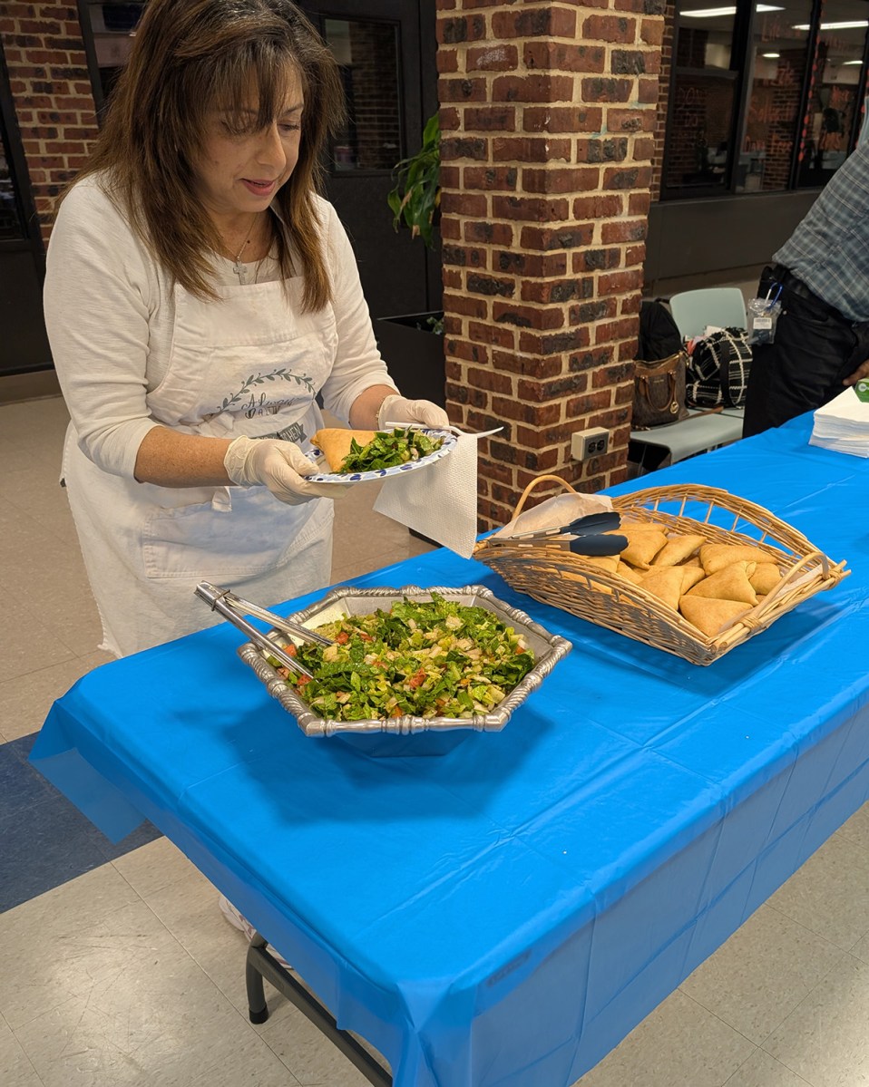 Roslyn Adult Education instructor Naela Zeidan cooking up Mediterranean dishes.