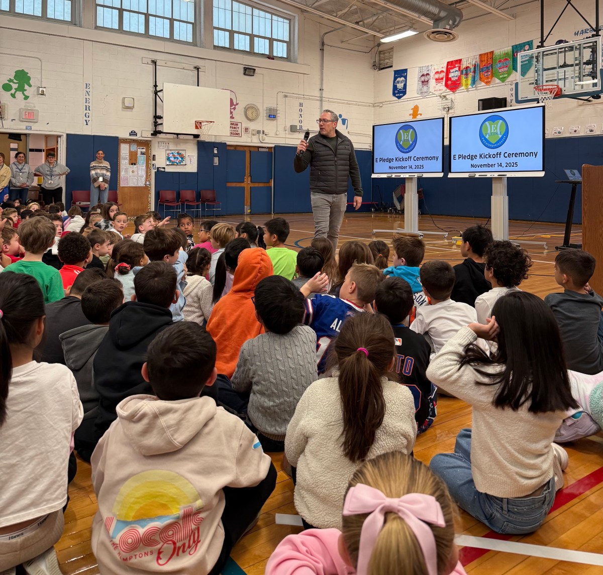Gary Falkowitz speaks to students at the E-Pledge kickoff ceremony at Harbor Hill Elementary School.