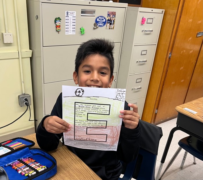 A student with his E-Pledge for World Kindness Day.