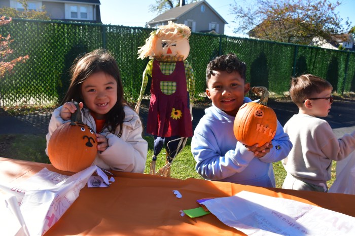 Students decorated pumpkins at the Harvest Festival.